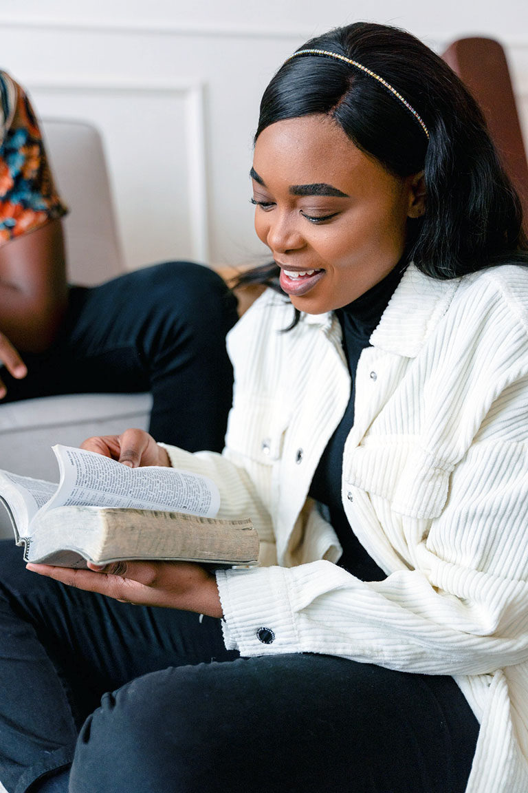Smiling Woman Reading Scripture